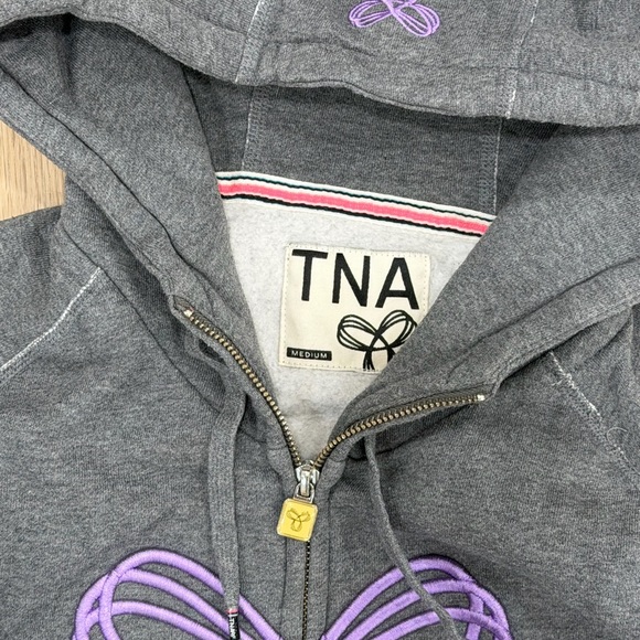 TNA' Dark Gray Zip Hoodie with Purple Logo - Picture 2 of 2